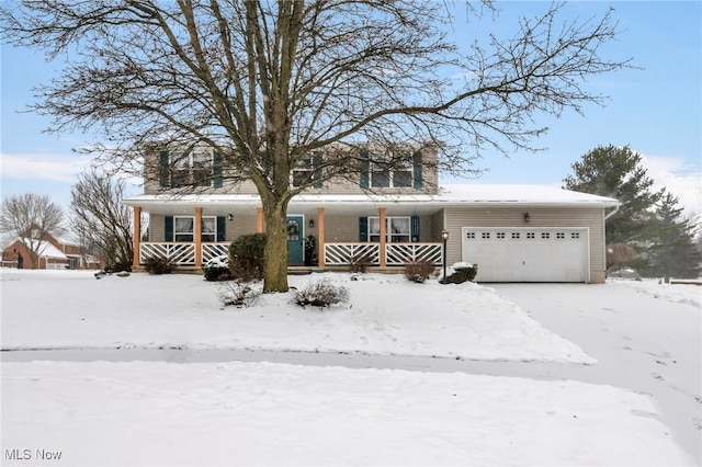 view of front of house with a porch and a garage