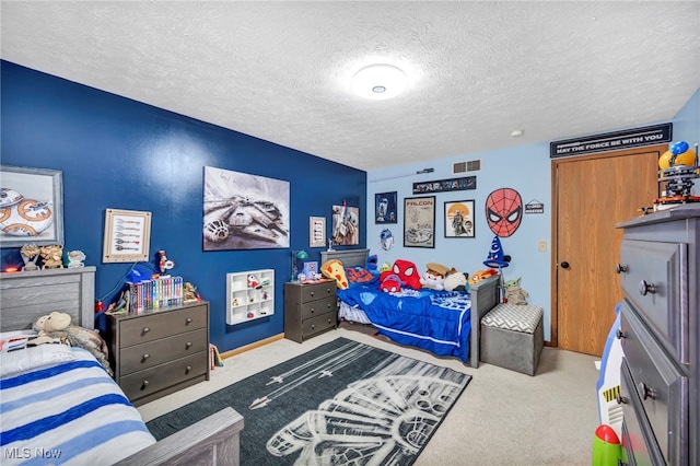 carpeted bedroom with a textured ceiling