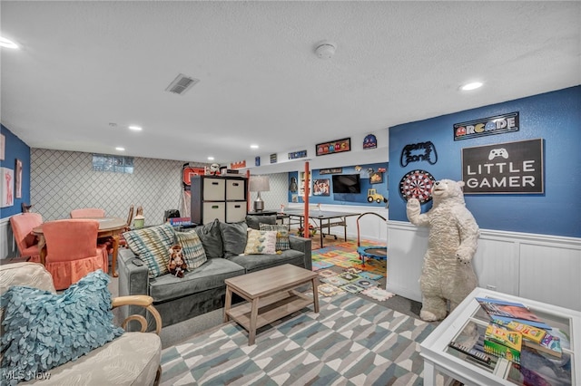 living room with a textured ceiling