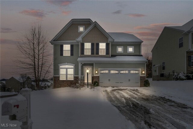 craftsman house with a garage