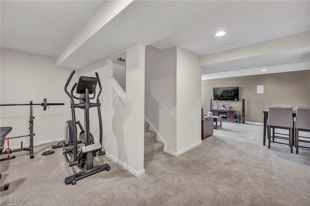 exercise area with light colored carpet