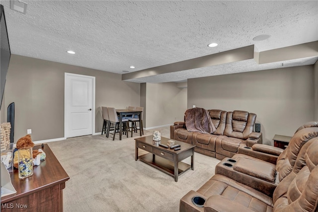 carpeted living room featuring a textured ceiling