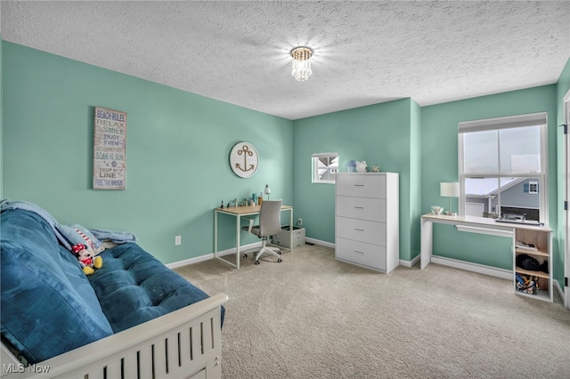 office with carpet floors and a textured ceiling