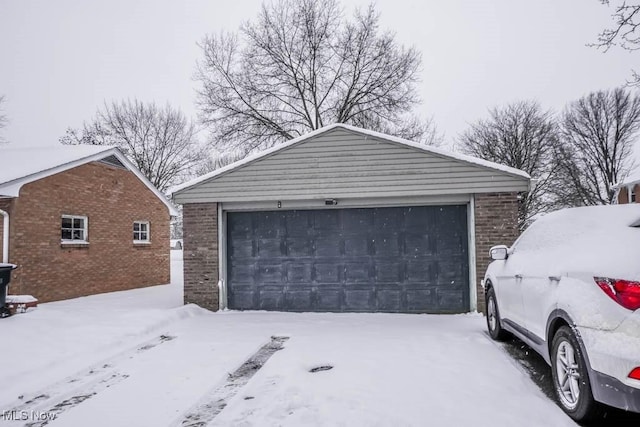 view of snow covered garage