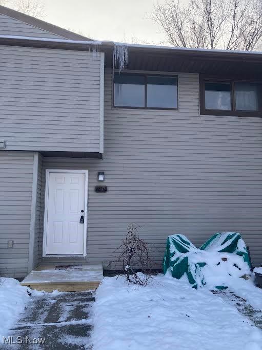 view of snow covered property entrance