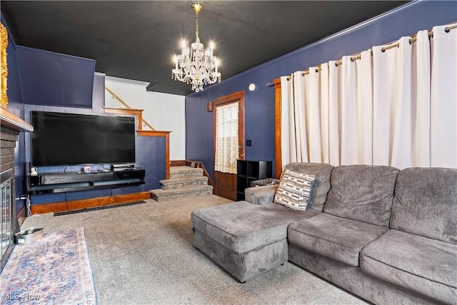 carpeted living room with a brick fireplace and an inviting chandelier