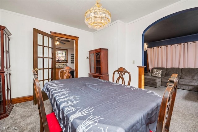 carpeted bedroom featuring an inviting chandelier and ornamental molding