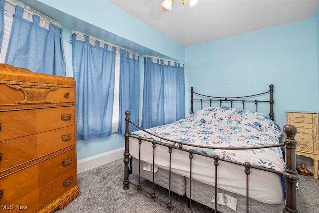 bedroom with ceiling fan and carpet