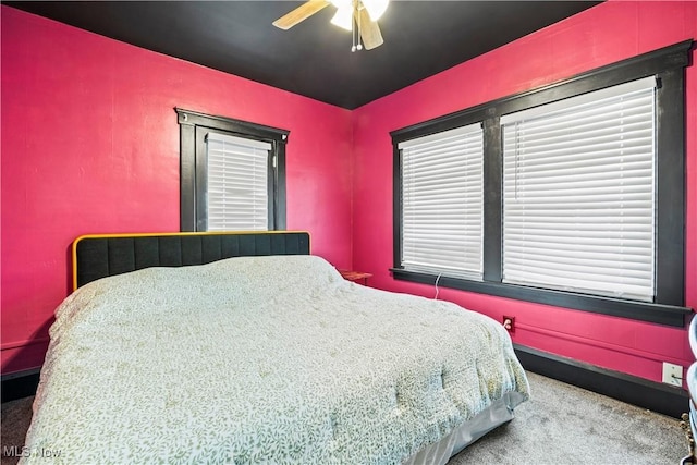 carpeted bedroom with ceiling fan