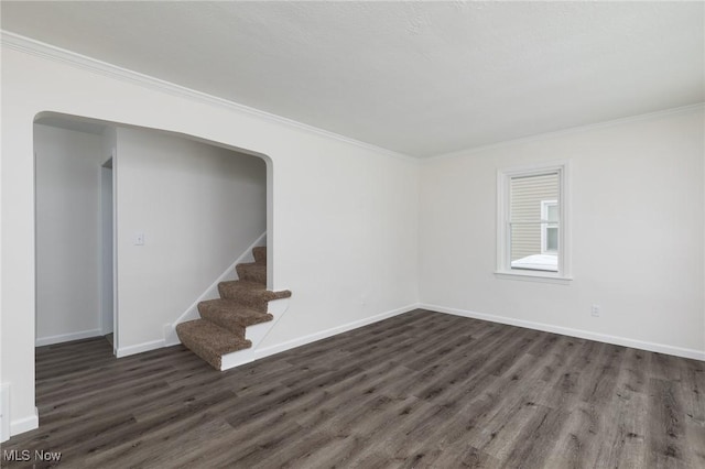 unfurnished room featuring crown molding and dark hardwood / wood-style floors