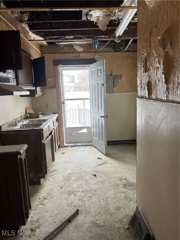 kitchen featuring sink and dark brown cabinetry