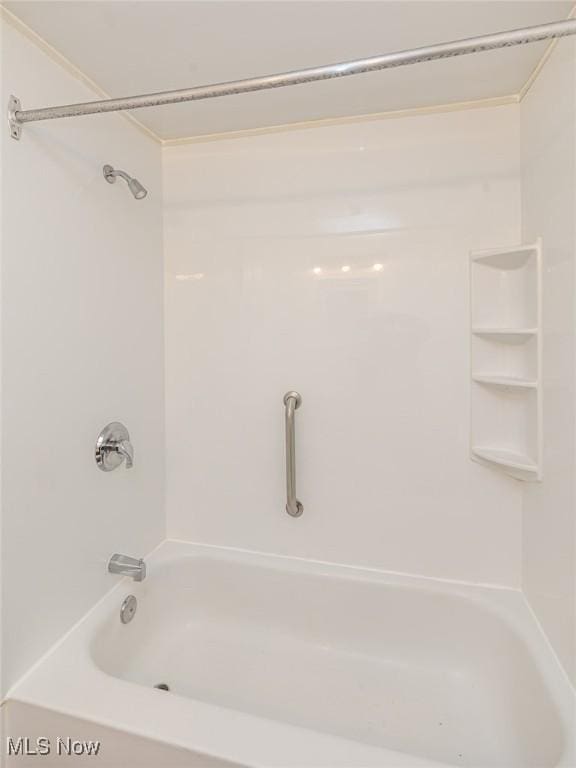 bathroom featuring washtub / shower combination