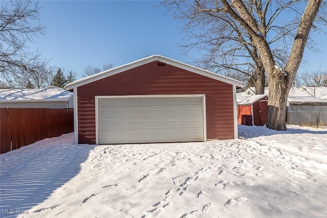 view of snow covered garage