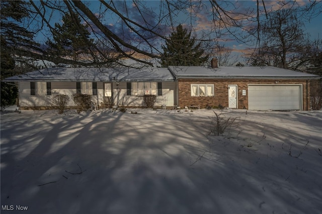 single story home featuring a garage