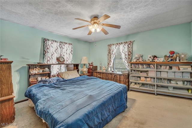 bedroom featuring a textured ceiling and ceiling fan