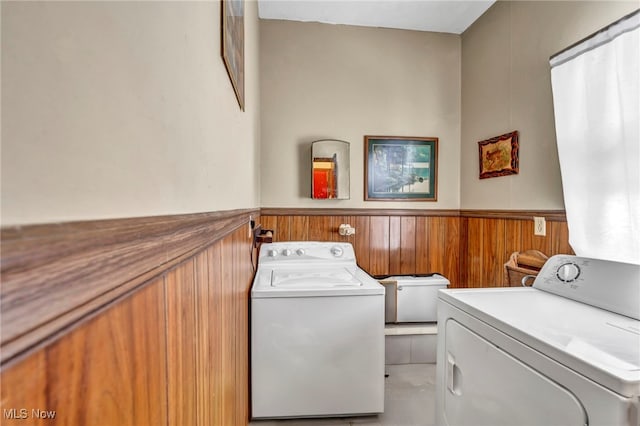 clothes washing area with washer and clothes dryer