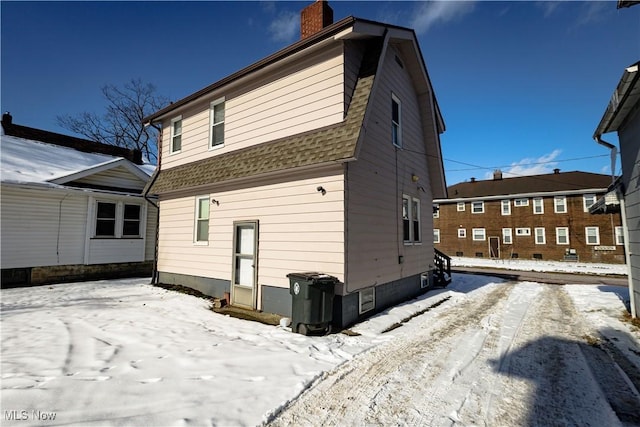 view of snow covered property