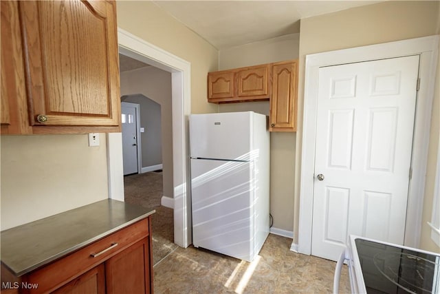 kitchen featuring white fridge