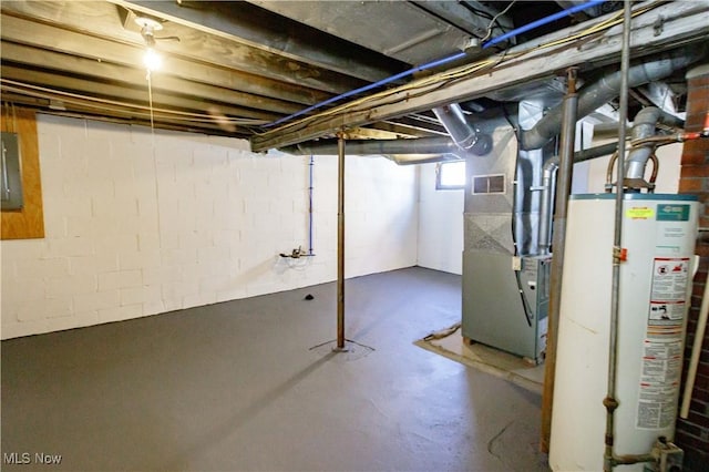 basement featuring water heater and heating unit