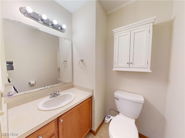 bathroom featuring tile patterned floors, vanity, and toilet