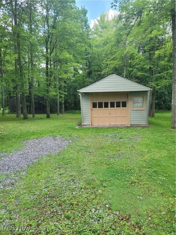 garage with a lawn