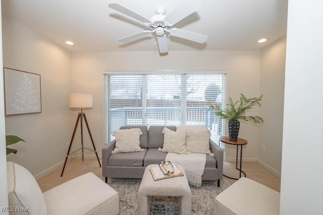 living room with ceiling fan and light tile patterned floors