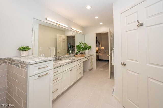 bathroom with vanity and tile patterned floors