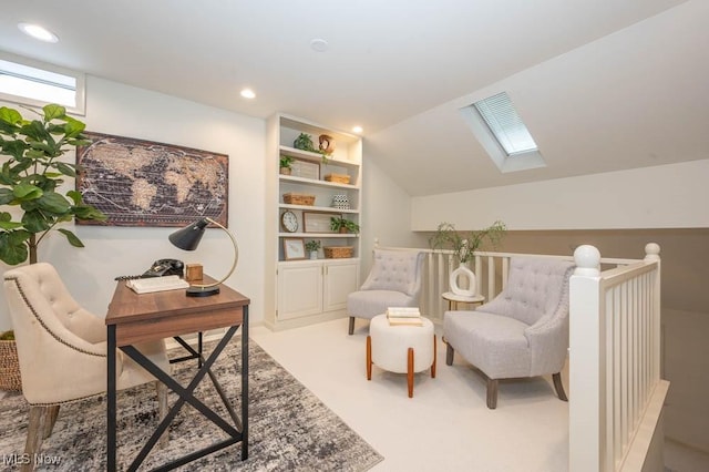 sitting room featuring vaulted ceiling, built in features, and light colored carpet