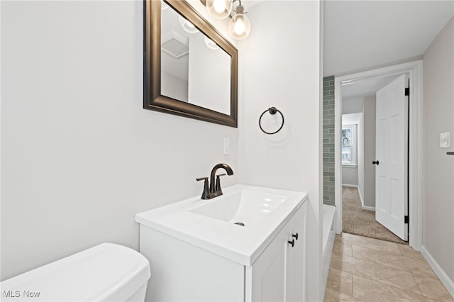 bathroom with toilet and vanity