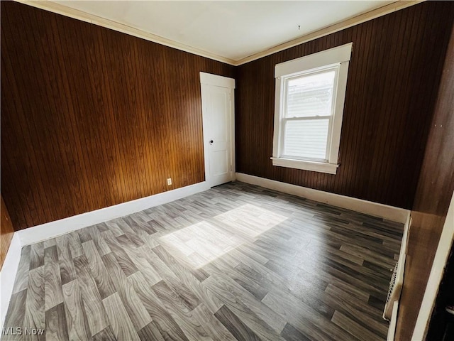 spare room featuring hardwood / wood-style flooring