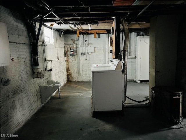 basement with washer and clothes dryer