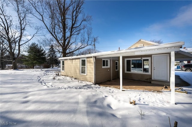 view of snow covered house