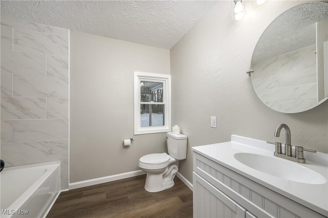 full bathroom featuring toilet, a textured ceiling, hardwood / wood-style floors, shower / bathtub combination, and vanity