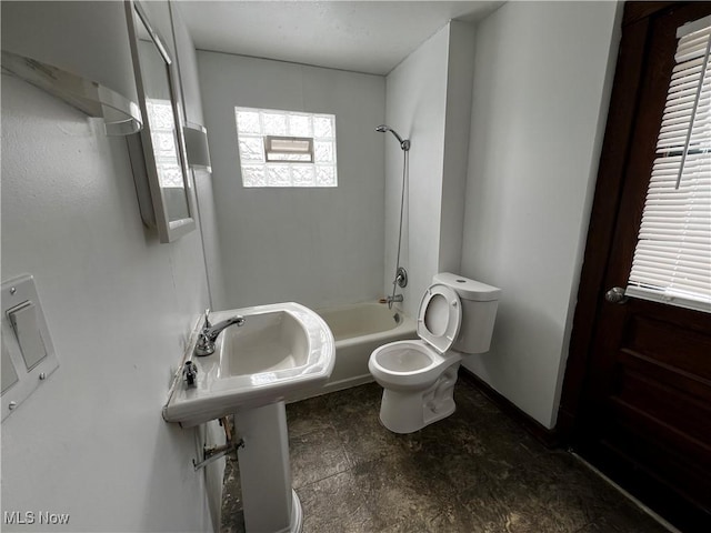 bathroom with toilet and shower / bath combination