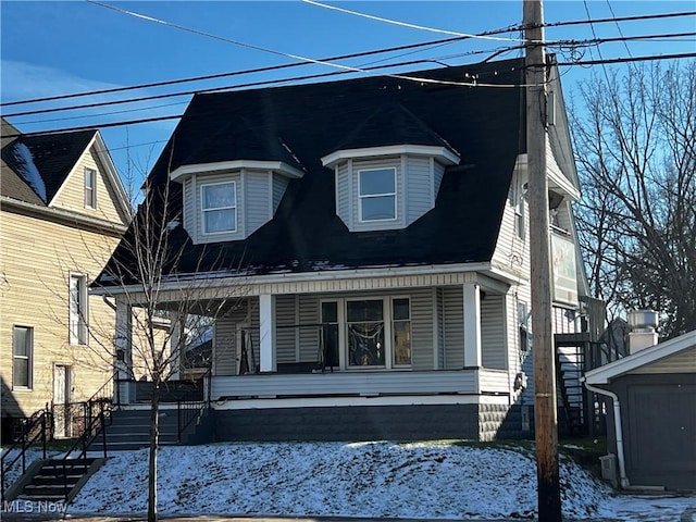 victorian house featuring covered porch