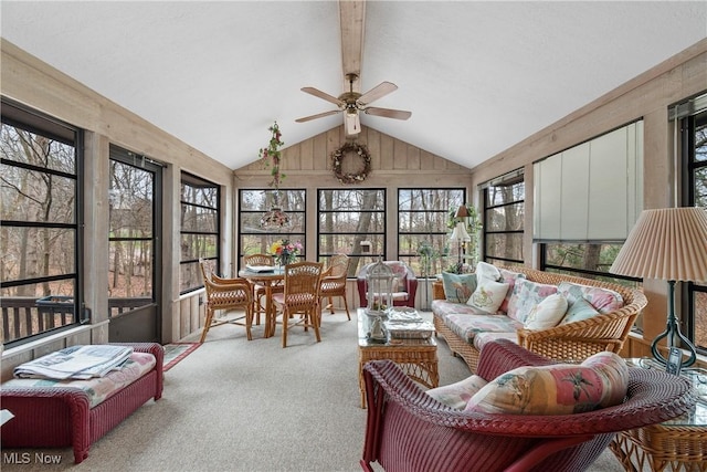 sunroom / solarium featuring ceiling fan and vaulted ceiling with beams