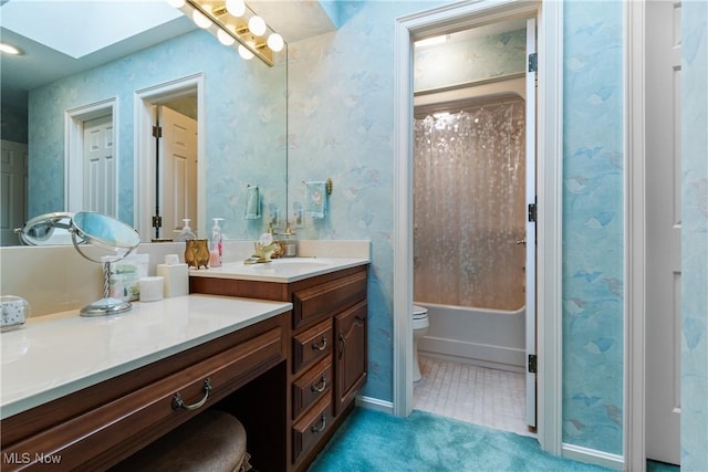 full bathroom with toilet, vanity, a skylight, and shower / bathtub combination