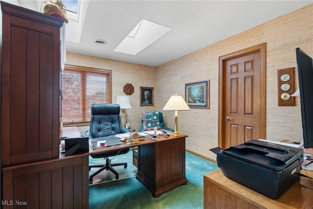 office space featuring a skylight and carpet floors