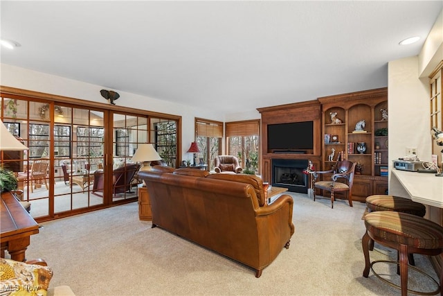 carpeted living room with a fireplace