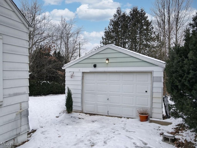 view of snow covered garage