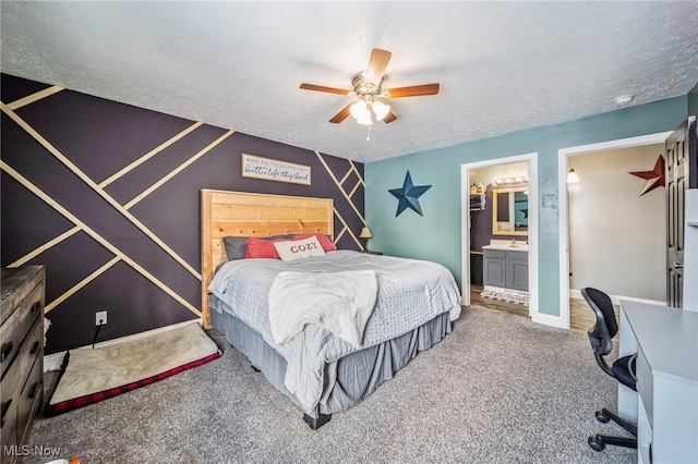 carpeted bedroom with a textured ceiling, ceiling fan, and connected bathroom