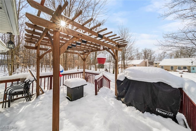 yard layered in snow featuring a pergola