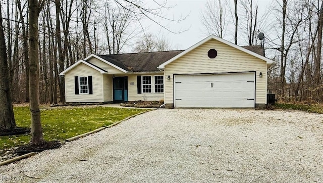 ranch-style house with an attached garage and driveway
