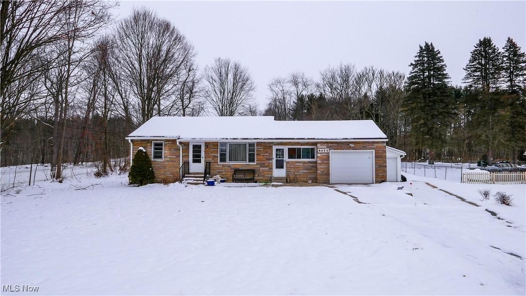 single story home with a garage