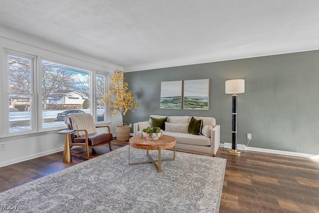 living room with dark wood-type flooring and plenty of natural light