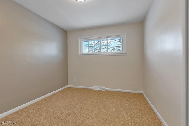 view of carpeted spare room