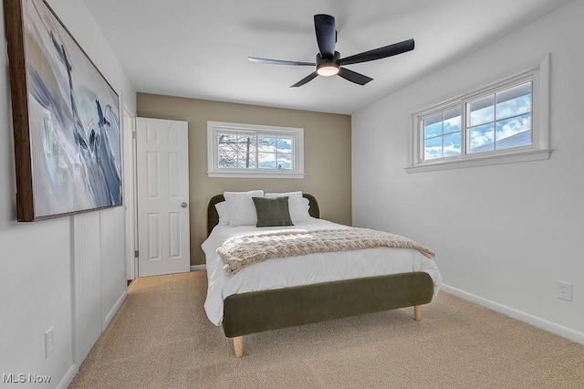 bedroom with light colored carpet and ceiling fan