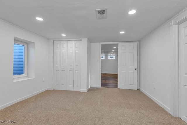 unfurnished bedroom with a closet and carpet