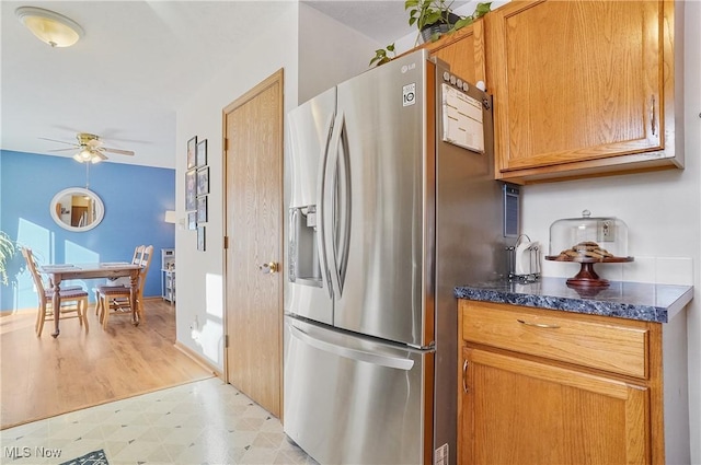 kitchen featuring ceiling fan and stainless steel fridge with ice dispenser