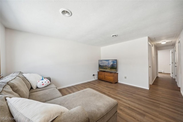 living room featuring dark wood-type flooring